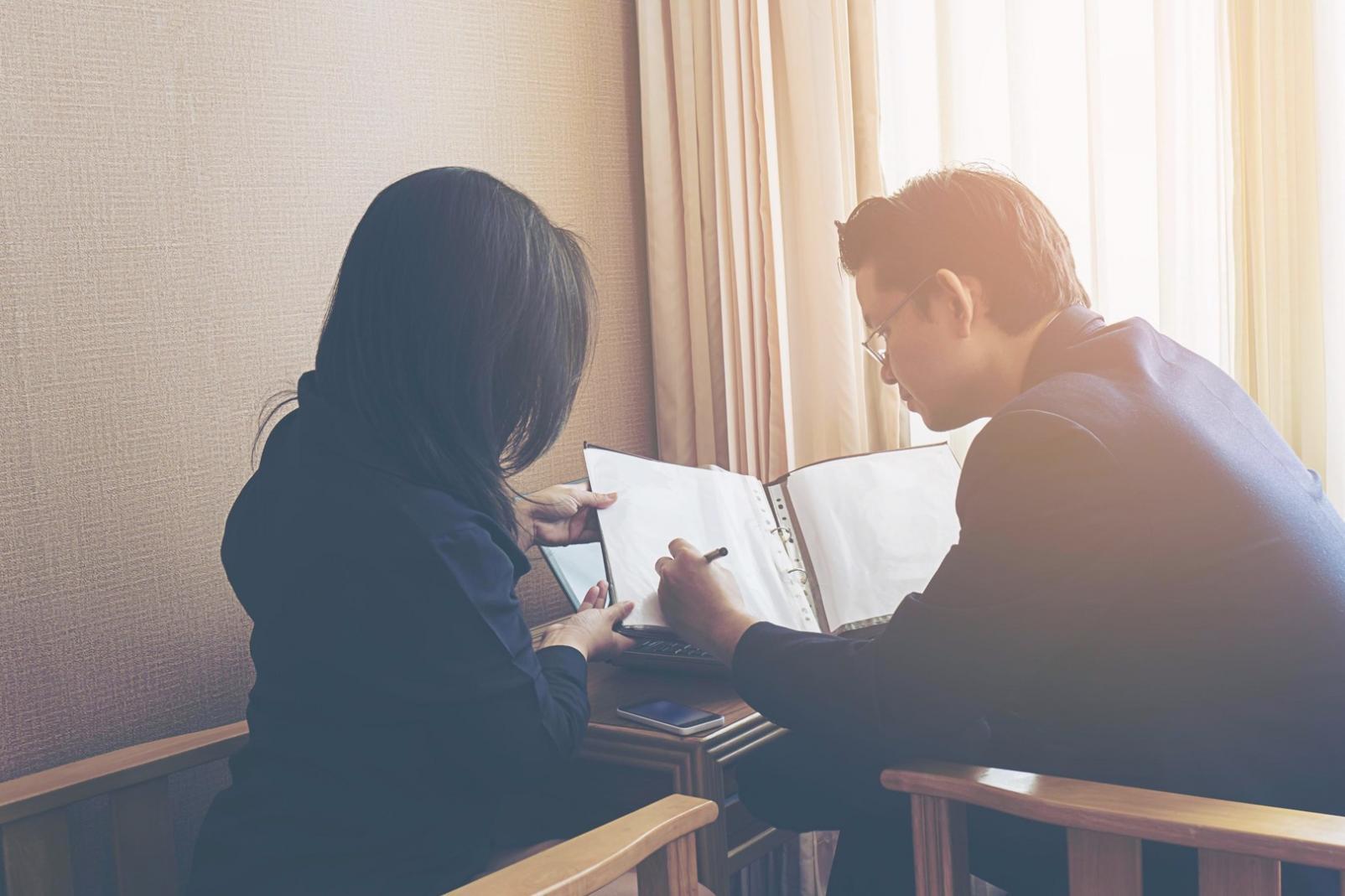 Business professionals analyzing financial reports