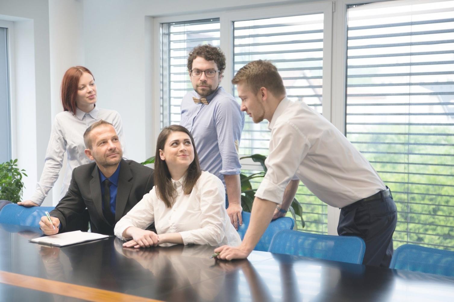 Business leaders discussing strategy around a conference table